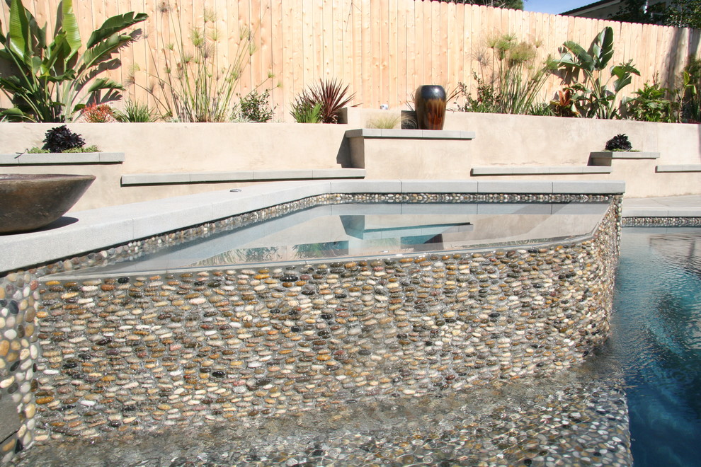 Design ideas for a contemporary swimming pool in Orange County.