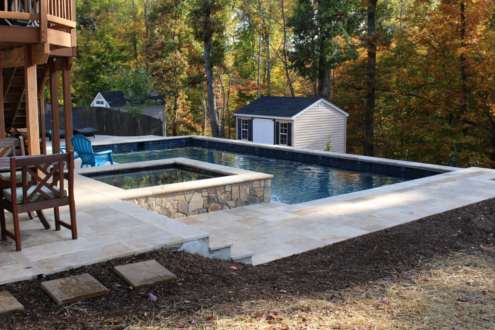 Mid-sized backyard stone and rectangular lap pool photo in DC Metro