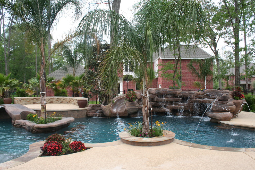 Island style pool photo in Houston