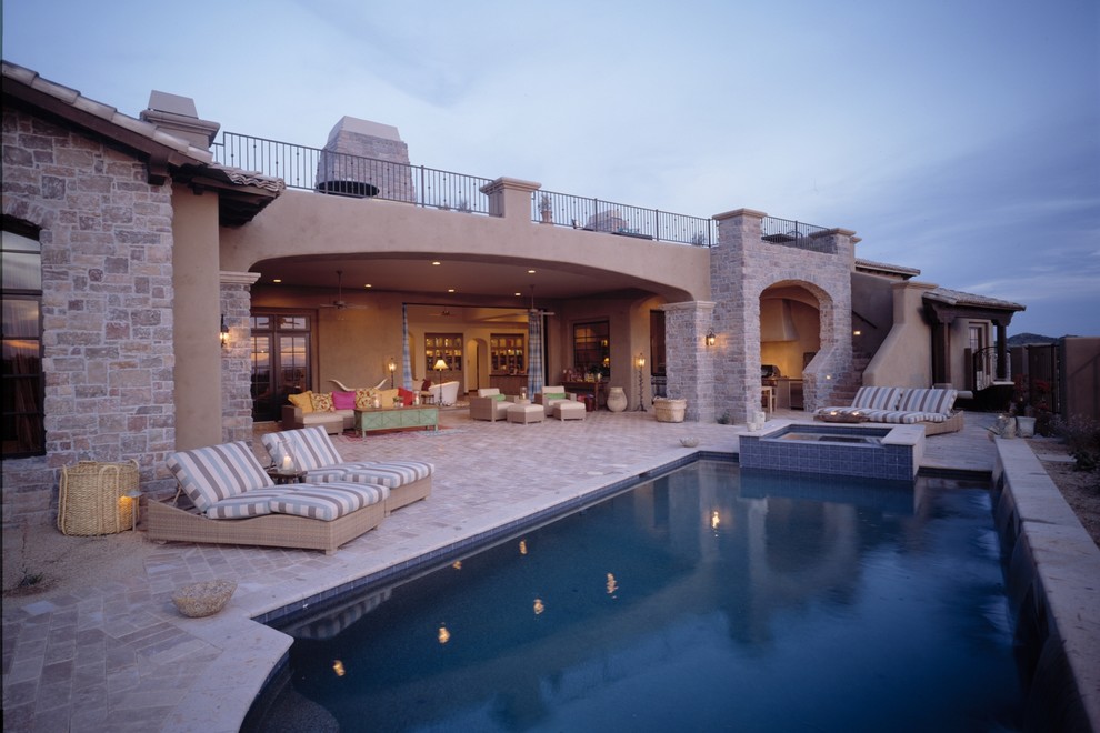 Example of a mid-sized tuscan backyard tile and rectangular lap hot tub design in Phoenix