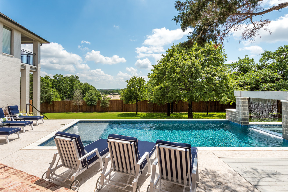 Pool fountain - backyard concrete and rectangular lap pool fountain idea in Dallas