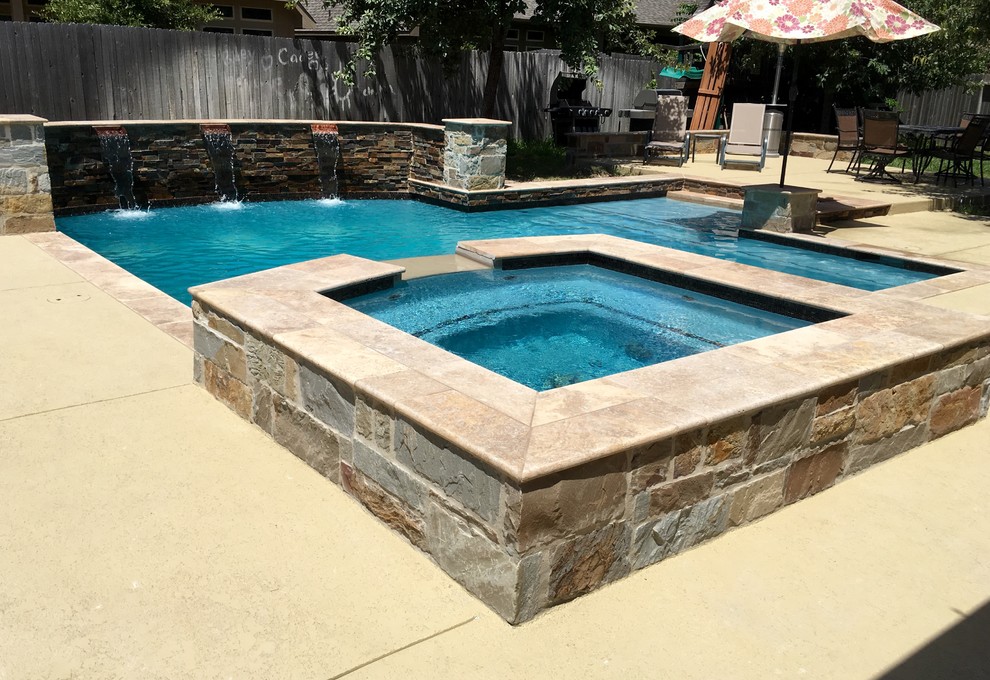 Inspiration for a medium sized contemporary back custom shaped natural hot tub in Austin with concrete slabs.