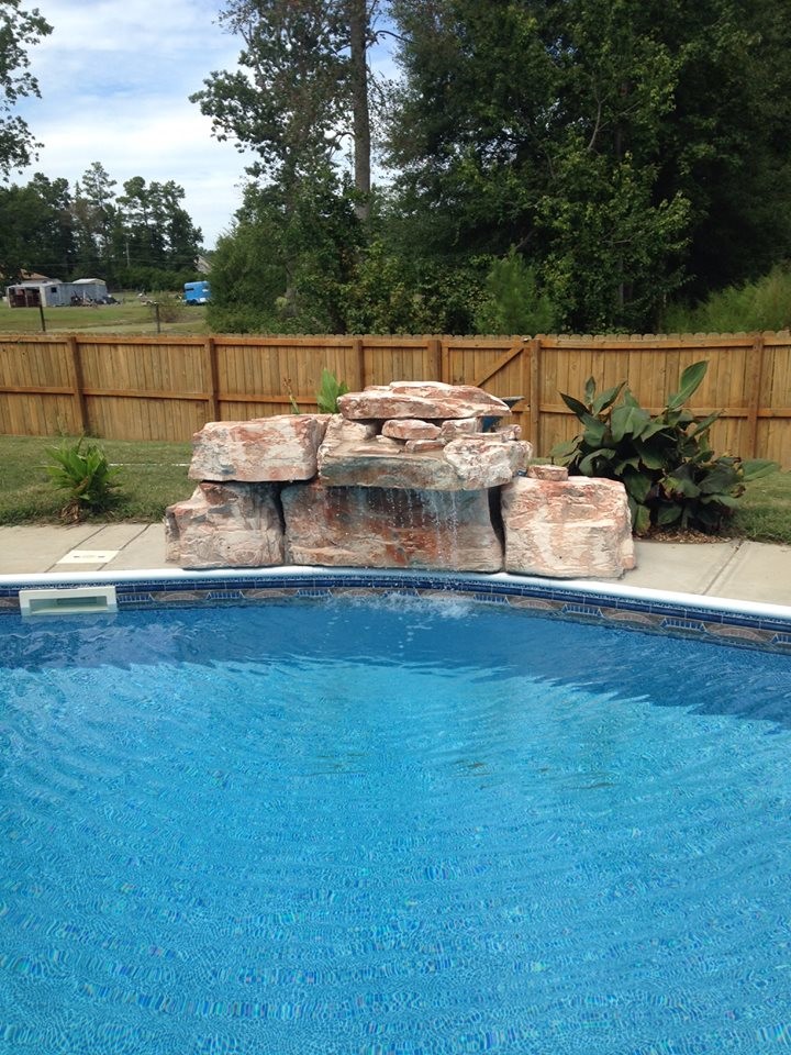 Kidney Pool with Waterfall and stand alone Hot Tub Coastal Pools