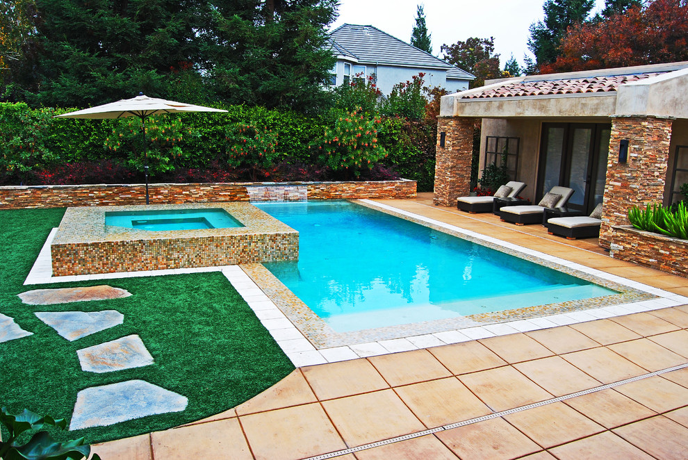 Design ideas for a large mediterranean back rectangular lengths hot tub in Other with concrete paving.