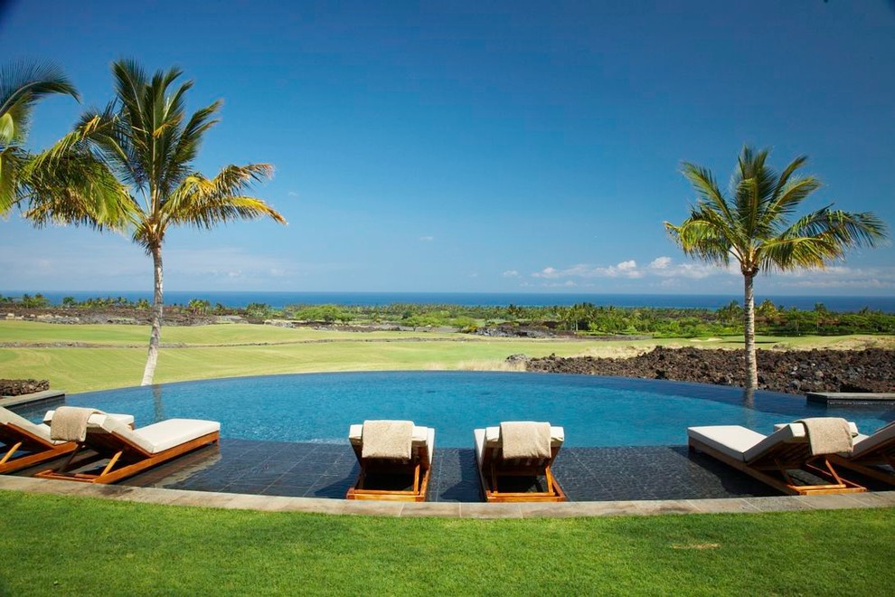 Photo of a large world-inspired round infinity swimming pool in Hawaii.