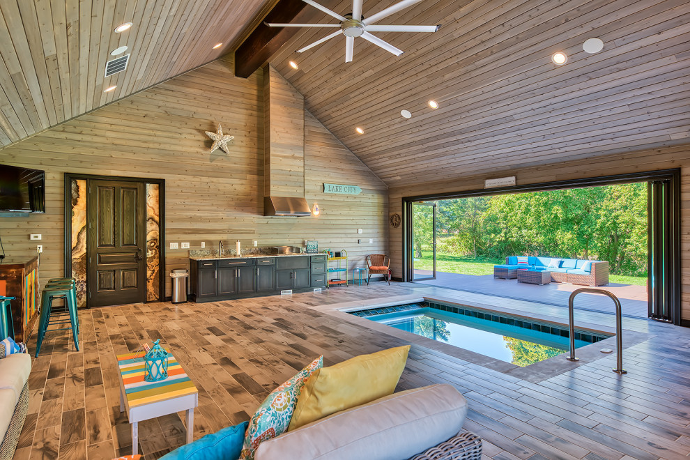 Foto de casa de la piscina y piscina alargada costera interior y rectangular con suelo de baldosas