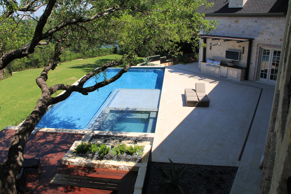 Photo of a large contemporary back l-shaped lengths hot tub in Austin with concrete paving.