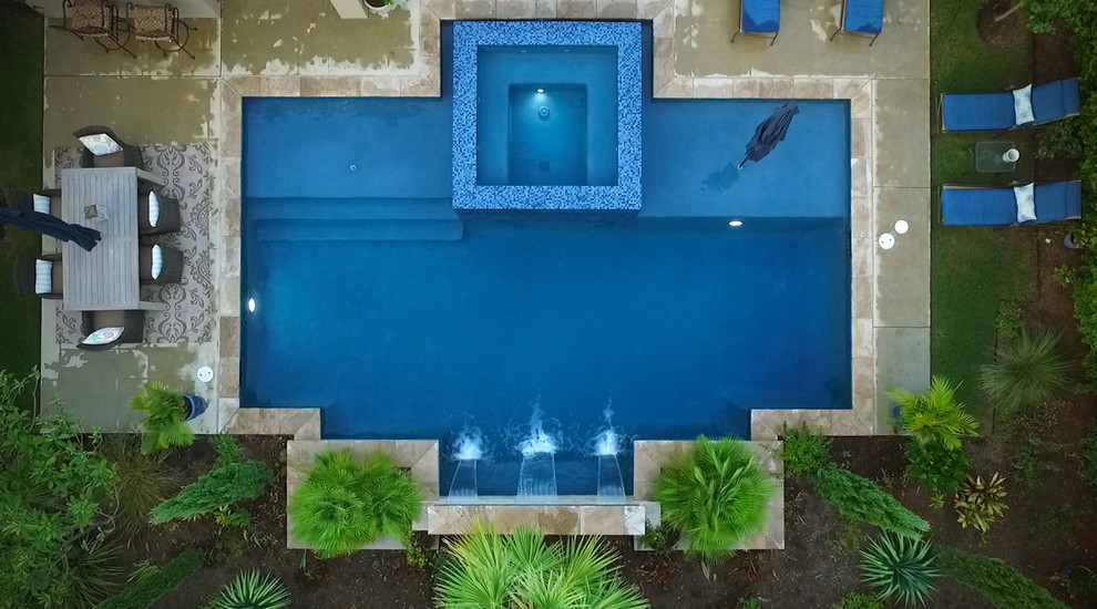 Mittelgroßer Moderner Pool hinter dem Haus in individueller Form mit Betonplatten in Austin