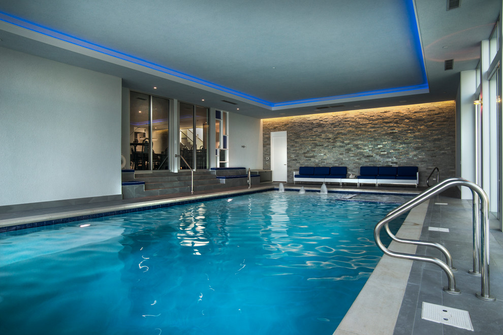 Design ideas for a medium sized modern indoor rectangular lengths hot tub in Milwaukee with tiled flooring.