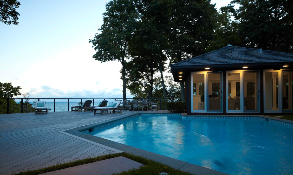 Photo of a contemporary back swimming pool in Chicago with a pool house and decking.