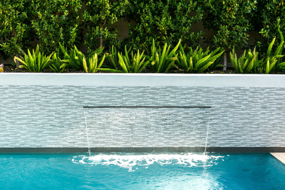 Inspiration for a coastal pool remodel in Orange County