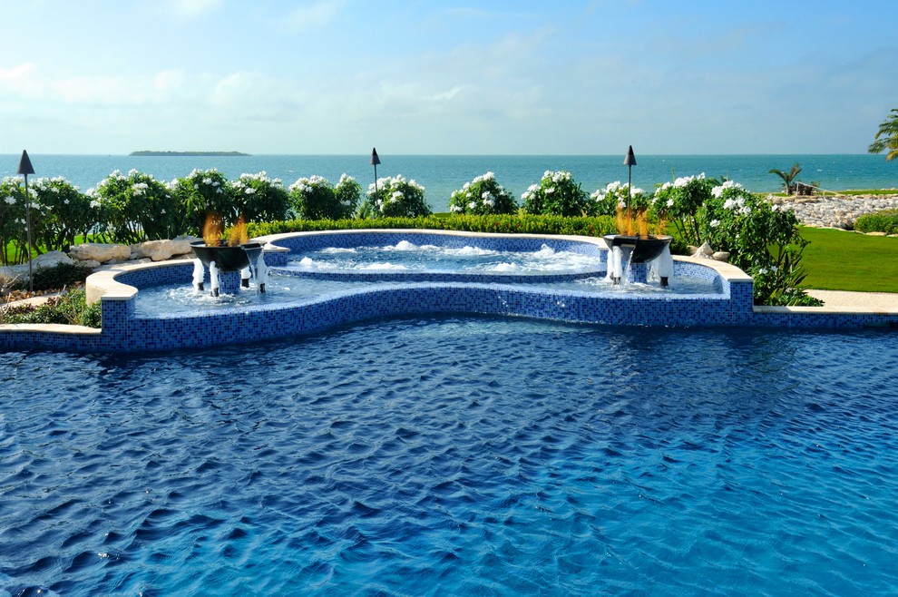 Inspiration for a world-inspired custom shaped swimming pool in Miami.