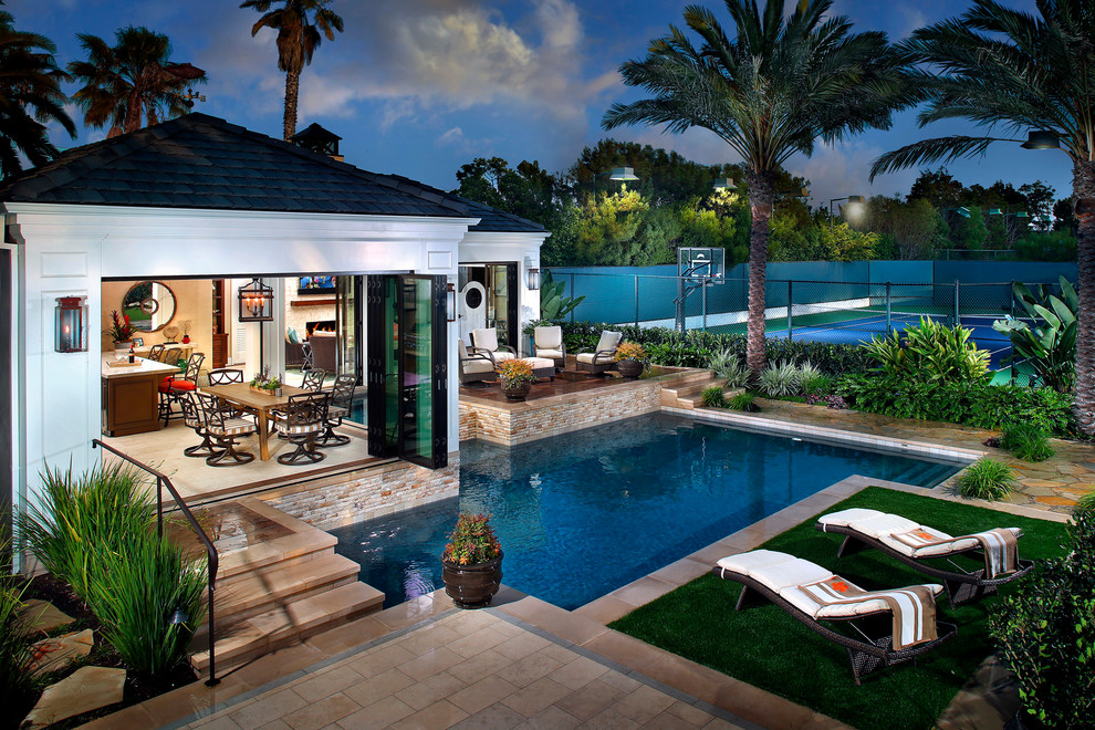 Medium sized traditional back rectangular swimming pool in Orange County with tiled flooring.