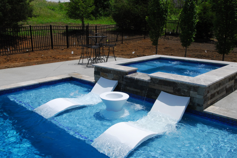 Ledge loungers, deck jets and hot tub Pool Kansas City by