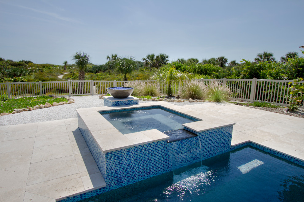 Trendy stone and rectangular hot tub photo in Orlando