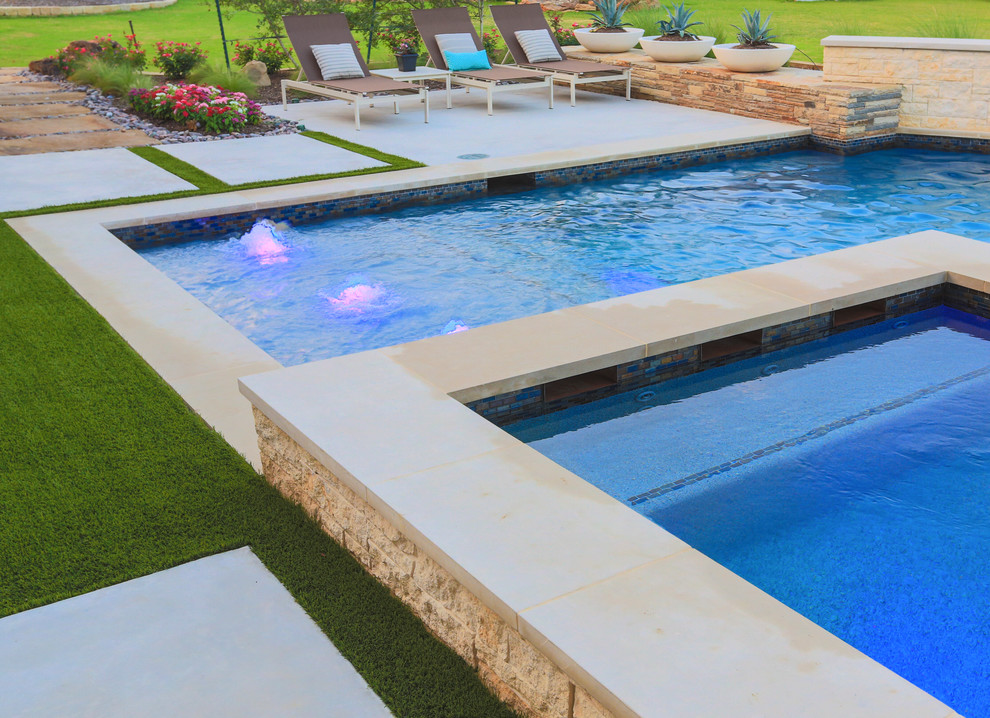 Inspiration for a large contemporary backyard concrete and l-shaped pool remodel in Dallas