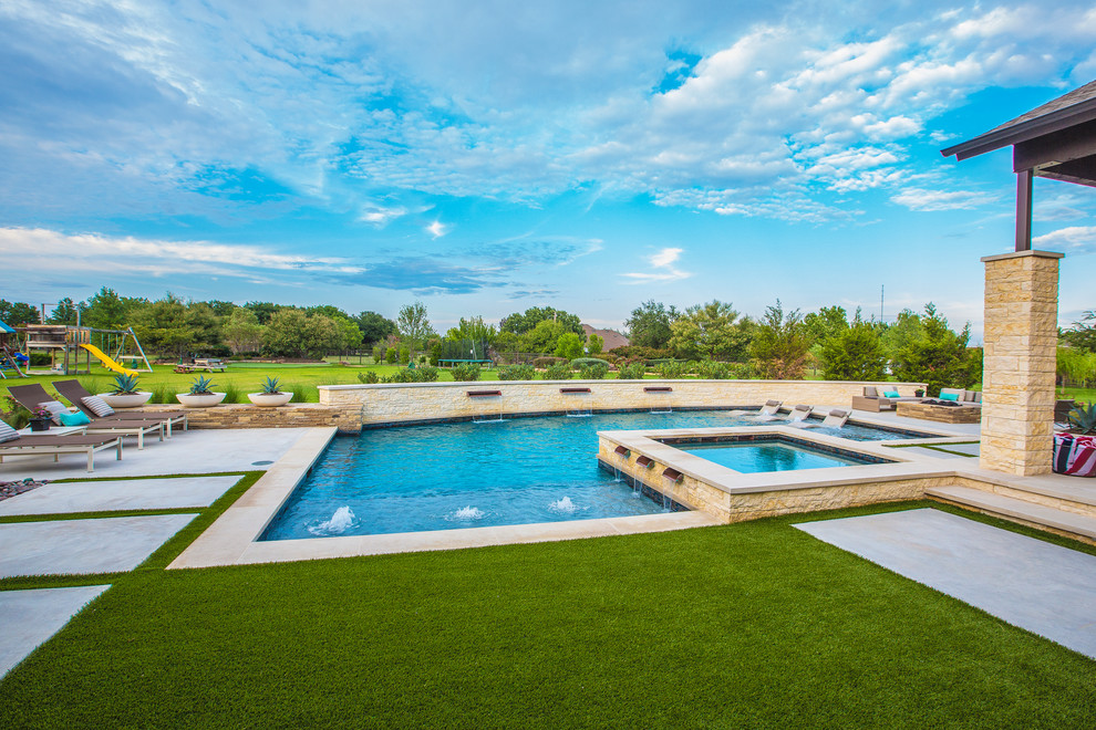 Photo of a large contemporary back l-shaped swimming pool in Dallas with concrete slabs.
