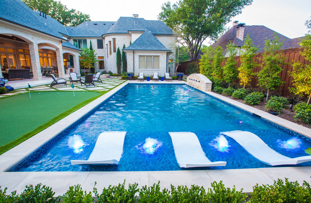Inspiration for a mid-sized mediterranean backyard rectangular and concrete paver lap pool fountain remodel in Dallas