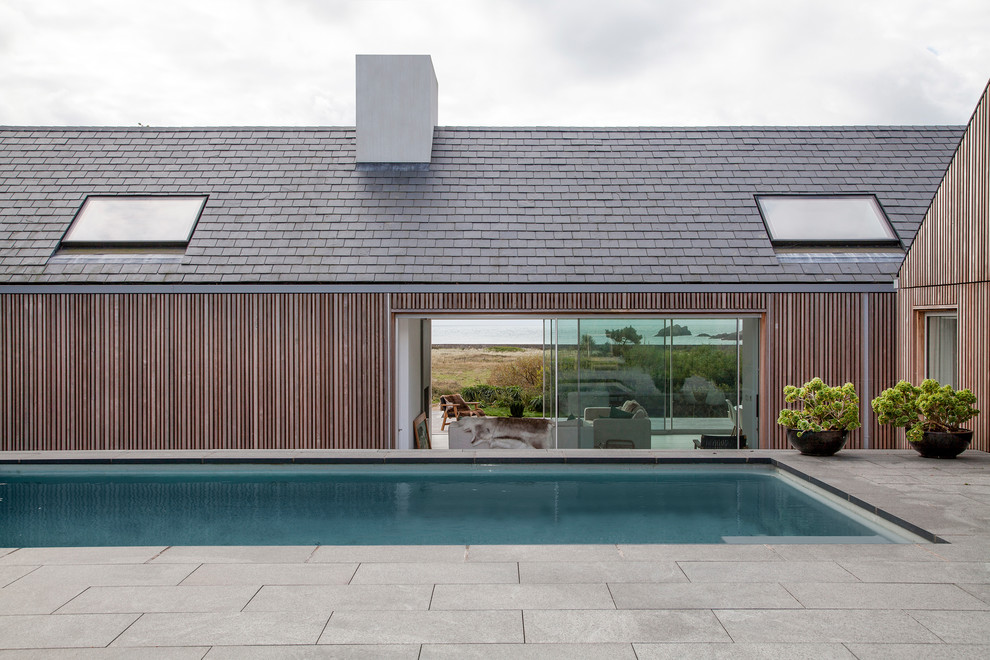Inspiration for a beach style rectangular lengths swimming pool in London.