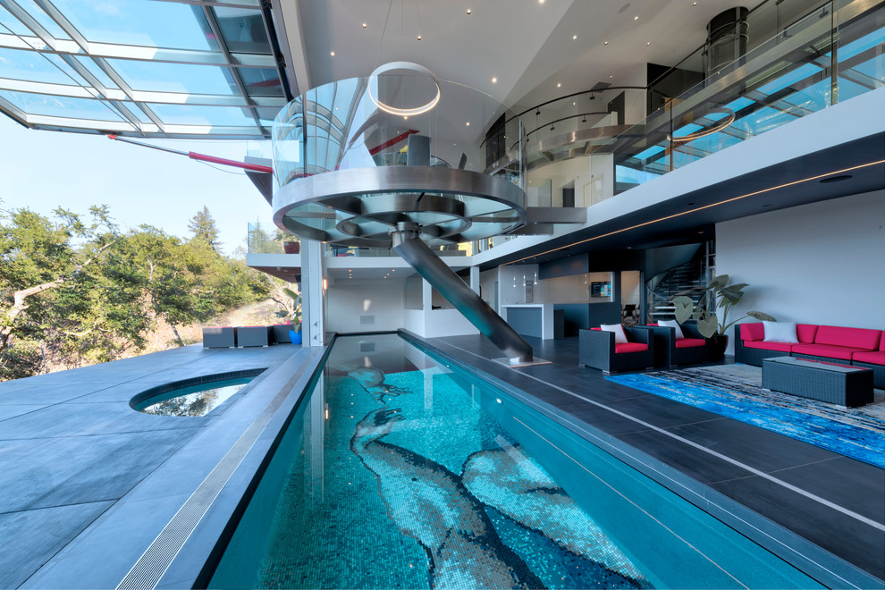 Ejemplo de piscina alargada contemporánea grande interior y rectangular