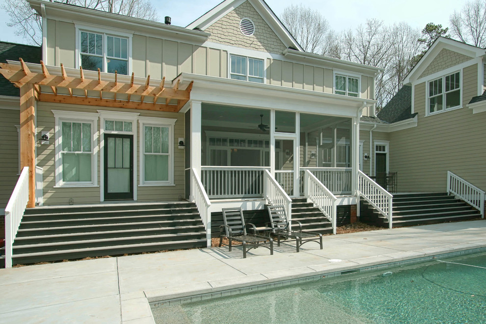 Diseño de piscina campestre rectangular en patio trasero con losas de hormigón