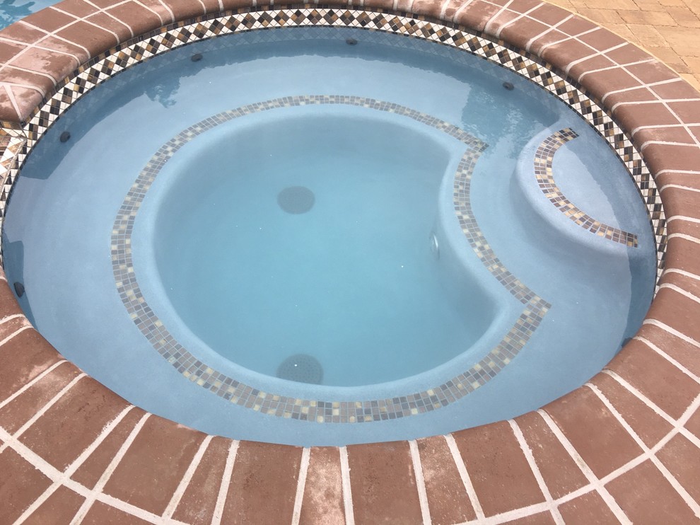 Lower Macungie large custom pool with spa, sunshelf, deck jets, and