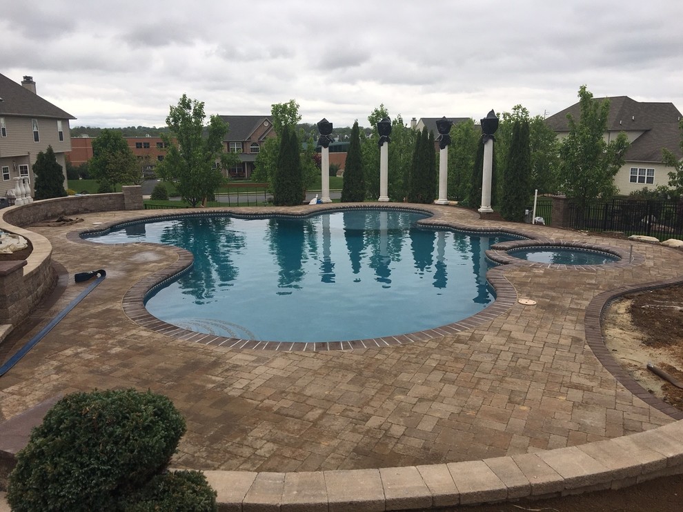 Lower Macungie large custom pool with spa, sunshelf, deck jets, and