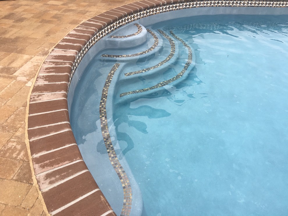 Lower Macungie large custom pool with spa, sunshelf, deck jets, and