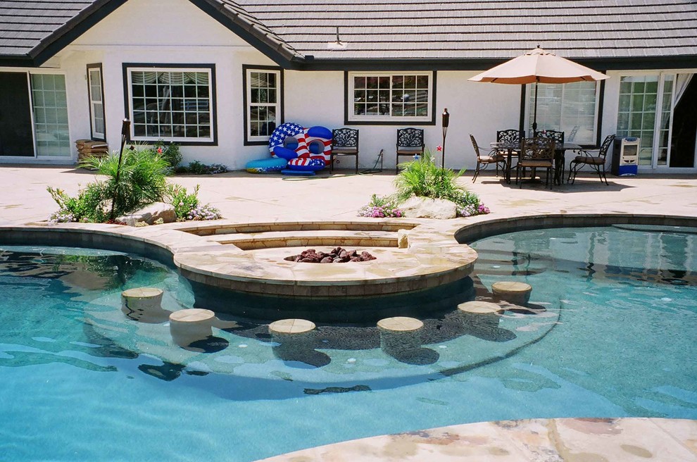 Hot tub - large traditional backyard stone and custom-shaped natural hot tub idea in Santa Barbara