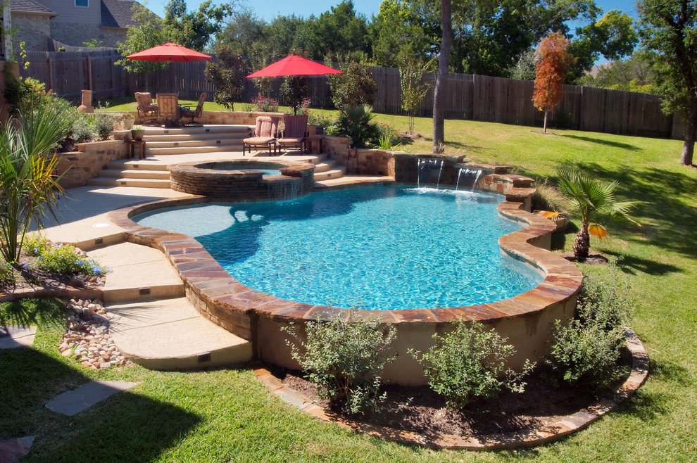 Photo of a medium sized traditional back custom shaped swimming pool in Austin with a water feature.