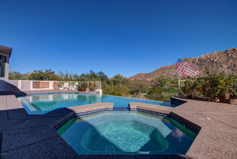 This is an example of a back custom shaped swimming pool in Phoenix.