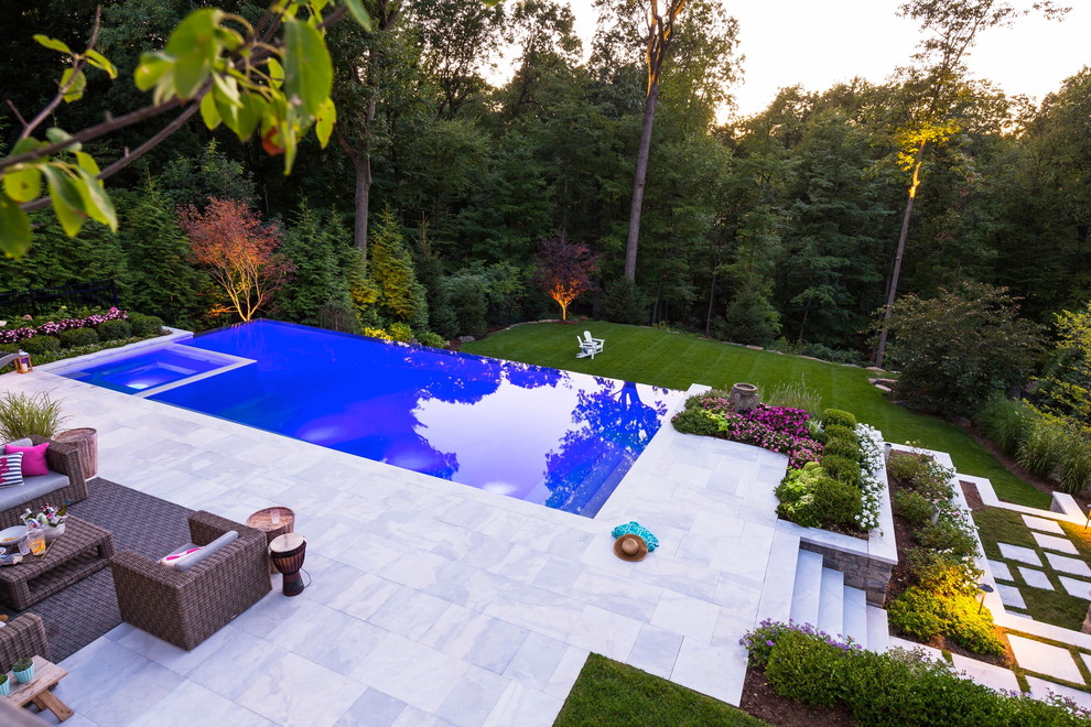 Huge trendy backyard stone and rectangular lap hot tub photo in New York