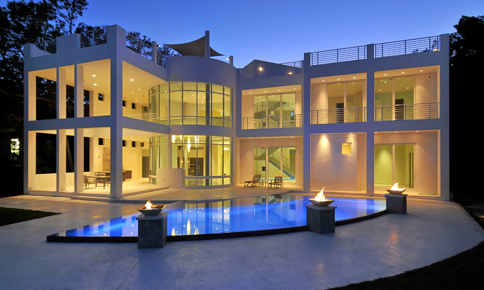 Moderner Pool hinter dem Haus in individueller Form mit Betonplatten in Tampa