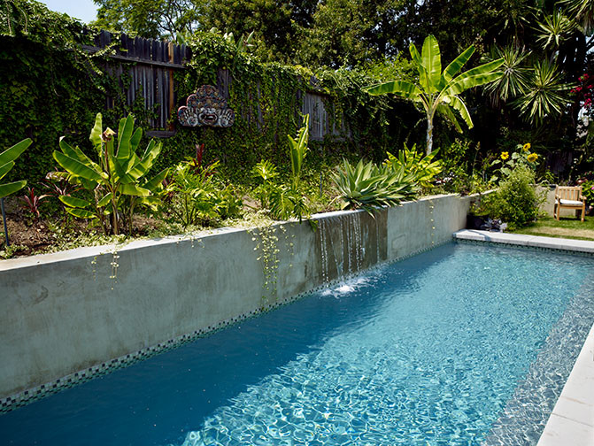 Large zen backyard rectangular and concrete pool photo in Los Angeles