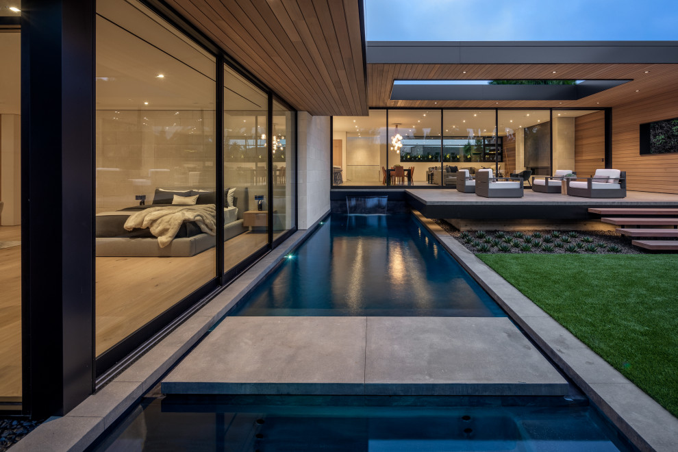 Pool - large contemporary rectangular lap pool idea in Orange County