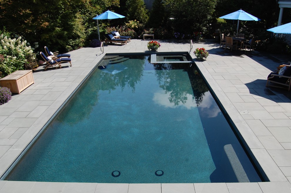 Mid-sized elegant backyard tile and rectangular lap pool house photo in Boston