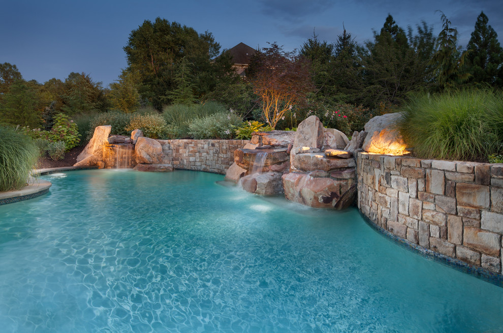 Inspiration for a medium sized classic back custom shaped lengths hot tub in DC Metro with brick paving.