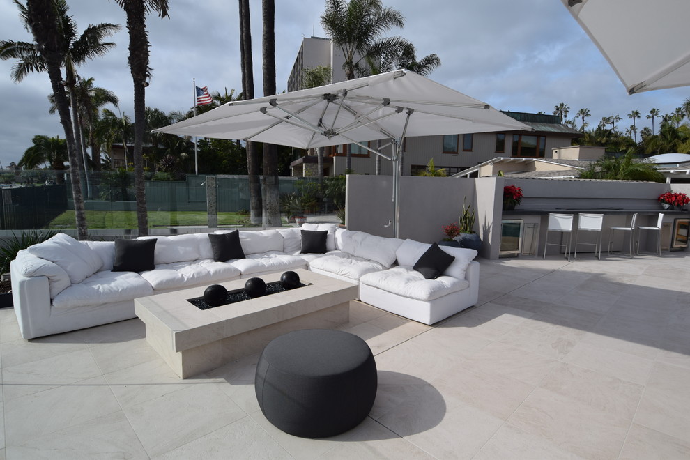 Patio - mid-sized modern backyard tile patio idea in San Diego
