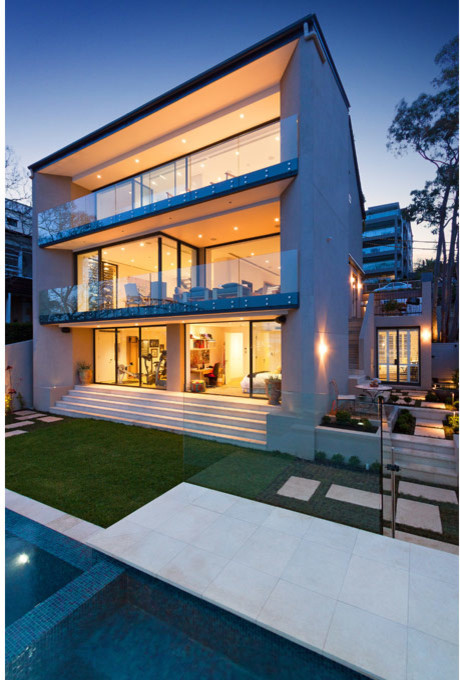 Inspiration for a medium sized contemporary back rectangular above ground swimming pool in Sydney with a water feature.