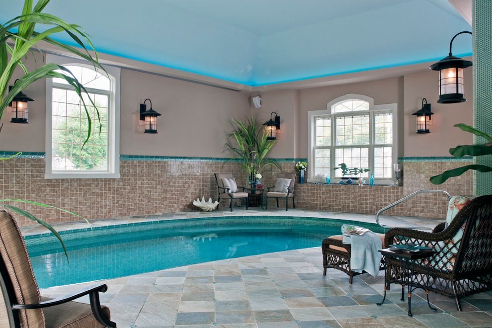 Example of a huge transitional indoor custom-shaped pool design in Boston