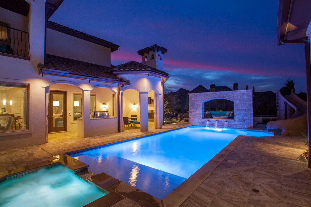 Inspiration for a mid-sized mediterranean backyard tile and rectangular hot tub remodel in Dallas