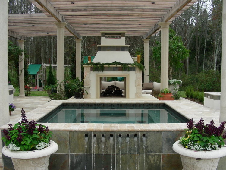 Idee per un'ampia piscina monocorsia mediterranea rettangolare dietro casa con una dépendance a bordo piscina e pavimentazioni in pietra naturale