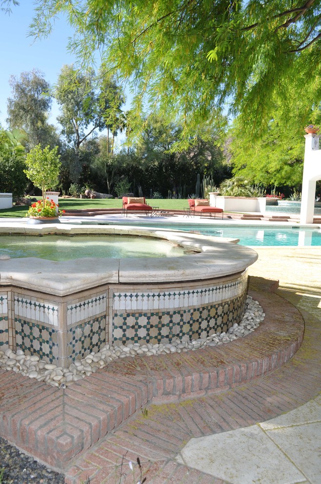 This is an example of a mediterranean rectangular swimming pool in Phoenix.