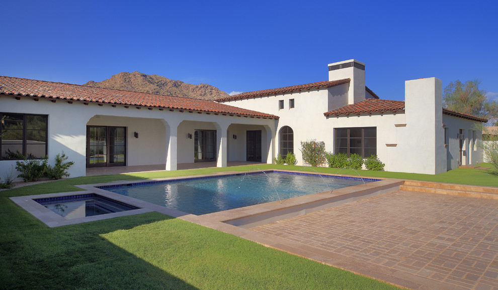 Example of a tuscan brick and rectangular pool design in Phoenix