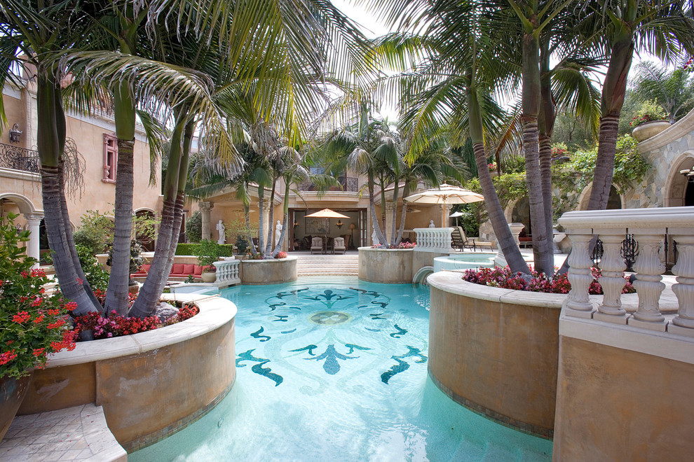 This is an example of a mediterranean custom shaped swimming pool in Other.