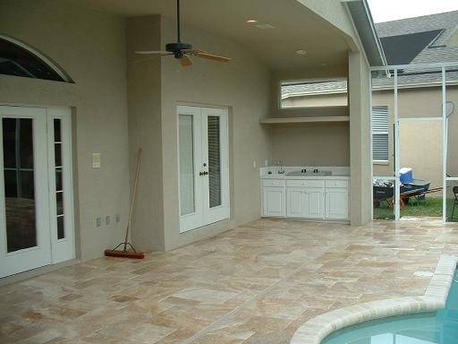Medium River Tumbled Pavers - Traditional - Pool - Tampa - by