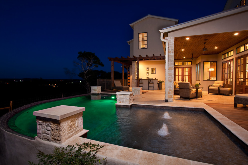 Inspiration for a timeless custom-shaped infinity pool remodel in Austin