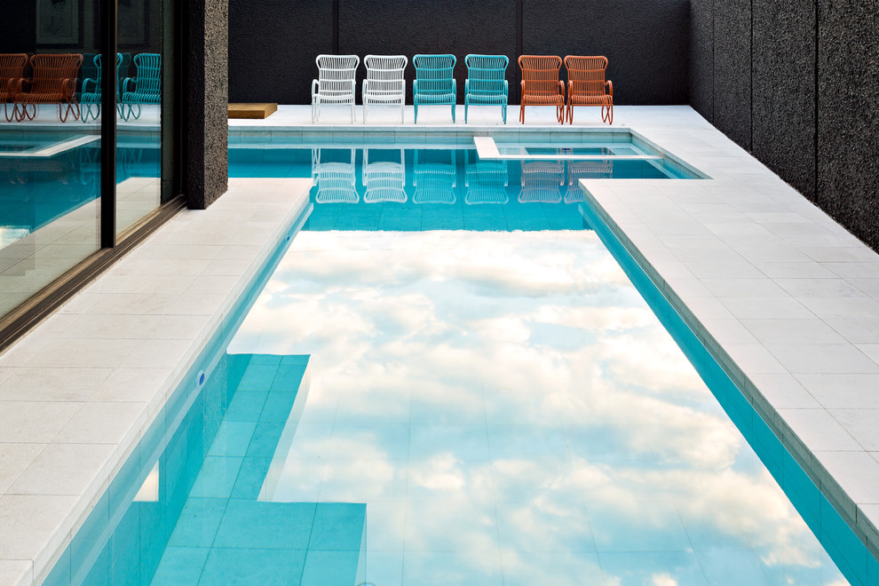 Inspiration for a large contemporary backyard custom-shaped lap pool remodel in Melbourne