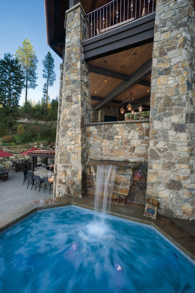 Inspiration for a medium sized rustic custom shaped swimming pool in Seattle.