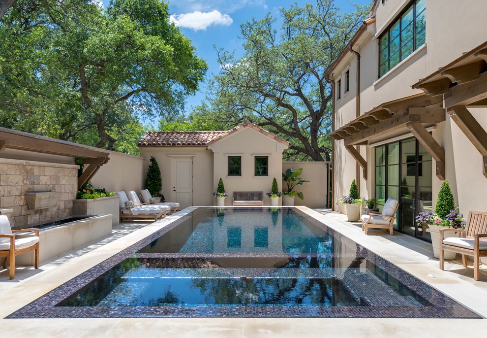 Design ideas for a mediterranean rectangular infinity swimming pool in Dallas.